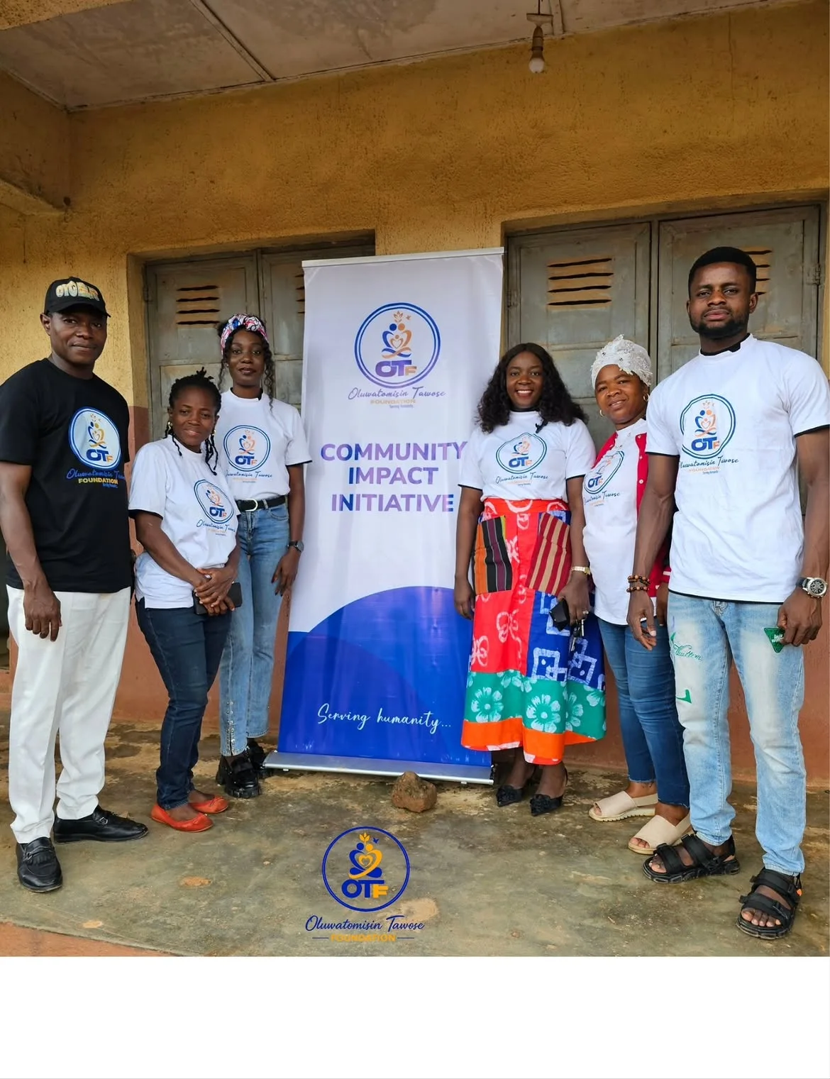 OTF volunteers and community members standing together during outreach